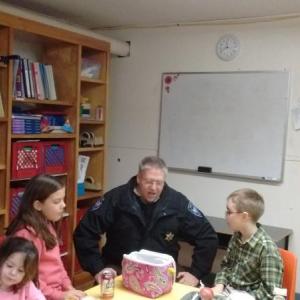 Lincoln County Sheriff Todd Brackett joins students during lunch at Southport Central School. JANE CARPENTER/Boothbay Register.