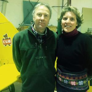 Steve Williams and wife Lisa Reece pose next to a vintage plane in one of their hangars at Wiscasset Municipal AIrport Feb. 20. SUSAN JOHNS/WIscasset Newspaper