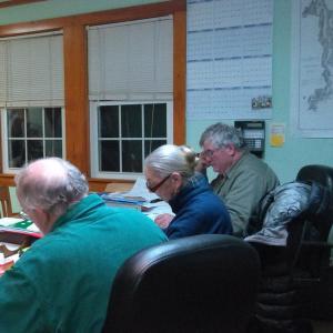 Southport selectmen review warrant for town meeting. JANE CARPENTER/Boothbay Register