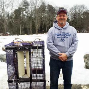 Tim Simmons with one of his shrimp traps, at his Boothbay store, T&D Variety. SUZI THAYER/Boothbay Register