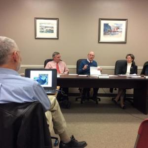 Bob Faunce, foreground, listens to the Boothbay Harbor selectmen’s concerns and questions about coastal flooding. From left are selectmen Russ Hoffman, Bill Hamblen, Denise Griffin and Wendy Wolf. KATRINA CLARK/Boothbay Register