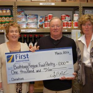 Gathered for a check presentation at the Boothbay Region Food Pantry are Chris Stevens, assistant branch manager at First National Bank, Tom Wilson, co-president at Boothbay Region Food Pantry and Brenda Blackman, branch manager at First National Bank. Courtesy photo