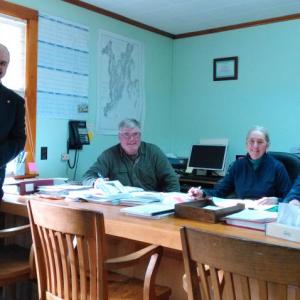 Mike Ciccarelli, left, new Southport emergency management director, is welcomed by selectmen, from left, Gerry Gamage, Mary Lou Koskela and Smith Climo. JANE CARPENTER/Boothbay Register