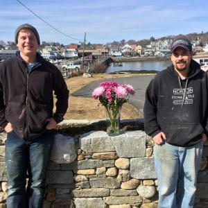 Joe Norton, left, and Willie Morton stand in front of the stone wall they built at Margaret and Steve Branch’s home, at the east end of the footbridge in Boothbay Harbor. SUZI THAYER/Boothbay Register Joe Norton and Willie Morton