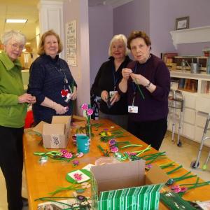 From left, Margaret Holden, Nan Jackson, Pat McMurray and Karen Gilbert making preparations for the April Garden Therapy craft that was used to decorate tables at the Volunteer Tea. Courtesy of Kathleen Marty