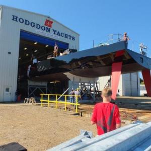 Comanche, a 100-foot monohull designed to be fastest of its kind in the world, makes its way out of the Hodgdon Yachts facility to be lowered into Boothbay waters in September 2014. The boat is one of roughly 400 built by the East Boothbay shipyard in its 200 years of existence. CASEY HOUSER/Boothbay Register