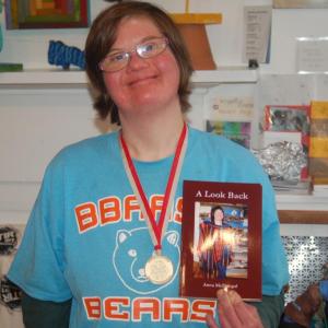 Anna McDougal with gold medal and book. ART MAYERS/Wiscasset Newspaper