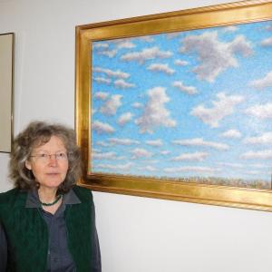 Cordula Mathias shown here with Chris Alexander's painting "Summer Clouds." Courtesy of the gallery
Cordula Mathias at her gallery Mathias Fine Art, Trevett, ME