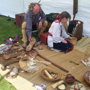 Jeff and Gail Usher prepare their Native American display at the Chapman-Hall House for the Three Traditions program. Courtesy photo
