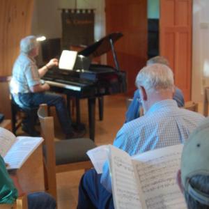 Chorus director Tony Antolini works with tenors and basses at LFC rehearsal on Monday, June 20. ART MAYERS/ Boothbay Register
