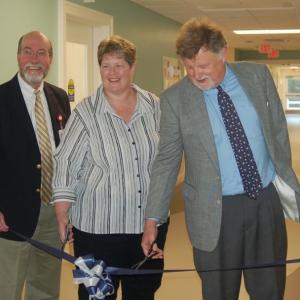 Laurie Zimmerli flanked by LincolnHealth officials James Donovan (left) and Bill Logan as they cut the ribbon on June 24. ART MAYERS/Boothbay Register
