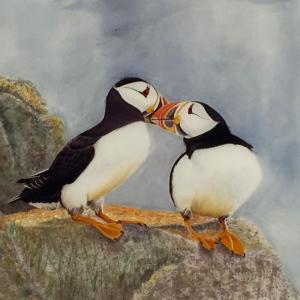 Carol P. Sullivan’s “Puffins” is but one of the artists paintings on silk to be exhibited in her show “Eyes Wide Open,” at River Arts. Courtesy of the venue Carol P. Sullivan