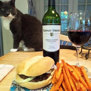 Ruby-2-shoes coveting the hamburger — or the wine. SUZI THAYER/Boothbay Register