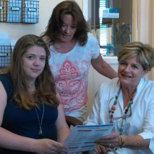 Kate Marone, Patricia Buck-Welton and Jane Good review information for the July 19 Community Center program about storage of drugs and liquor. JANE CARPENTER/Boothbay Register