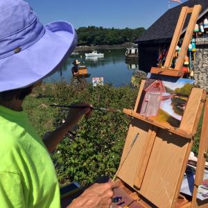 Leslie Piercy, from Rockland, was one of the plein air painters working across the road from at Knickercane Island on July 13. SUZI THAYER/Boothbay Register