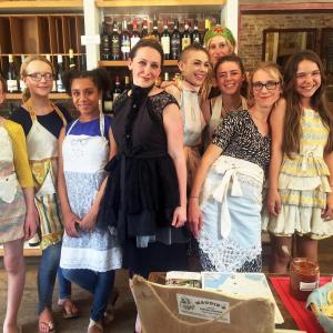 PaperDoll Aprons models show off their one-of-a-kind aprons in Treats during the Wiscasset Art Walk on June 30. SUZI THAYER/Boothbay Register