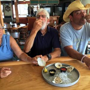 Three oyster lovers at the upstairs bar of The World is Mine Oyster. SUZI THAYER/Boothbay Register
