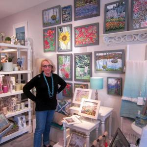 Francine Sokol with some of her paintings at BIRCH in Wiscasset during the evening of the July 28 Wiscasset Art Walk. Courtesy of Fran Sokol