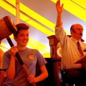 Mikayla Hardy assists auctioneer Bob Foster in selling an antique mallet. ART MAYERS/Boothbay Register