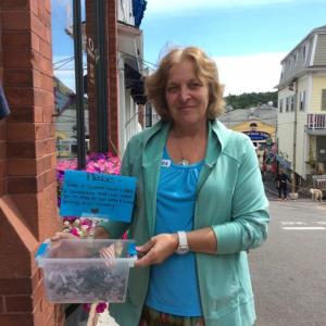 Barbara Abbott of Janson's Clothing Store shows off the bucket of “Little Soldiers” outside the store. KATRINA RICKERMANN/Boothbay Register