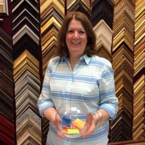 Susan Brackett of Boothbay Harbor Framers holds a fishbowl with Monday’s “Jeopardy” guesses. Will one of those names win the grand prize on Sept. 10? KATRINA RICKERMANN/Boothbay Register