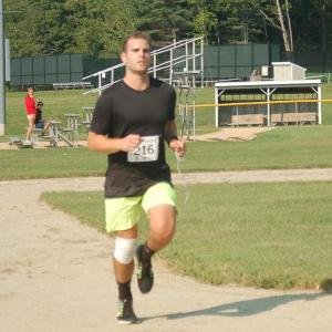 Allan Surette finishes strong as winner of the 5k race on Sunday. ART MAYERS/Boothbay Register