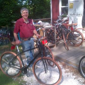 Doug Roberts at Oak Street Provisions, collecting bikes loaned by the Rotary Club. Courtesy of Patty Seybold
