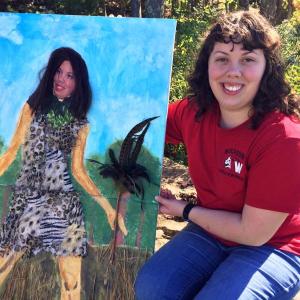 Barbara Welborn holds her self portrait, “Jungle Prom.” SUZI THAYER/Boothbay Register