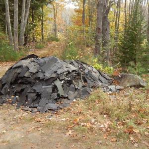 A truckload of roof shingles was illegally dumped in the High Ledge subdivision. Police are searching for the person or persons responsible for this dumpsite and two others on the peninsula. Courtesy of Matthew Smith