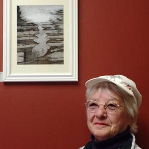 Photographer Cally Peaco and one of the images in her show at First Federal. Courtesy of BRAF