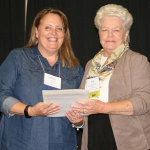 MSBA President Becky Fles presents the award to Sue Burge. Courtesy photo