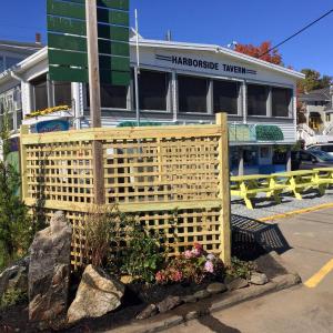 The pumping station at the west end of the footbridge in Boothbay harbor has been beautified with some new fencing and plants. SUZI THAYER/Boothbay Register