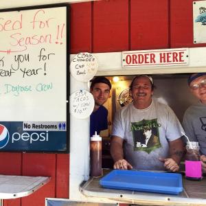 Owen Sterrs, left, Gary Starankewicz and Earle Tourtillotte say sayonara to their patrons from the summer of 2016 by throwing a fabulous feed at Dunton’s Doghouose in Boothbay Harbor. SUZI THAYER/Boothbay Register