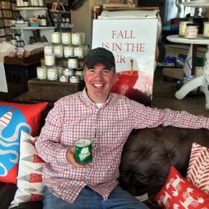 Michael Gaffney, owner of Seawicks Candle Company, holds one of his new creations, the Maine Candle, in his Boothbay Harbor shop. SUZI THAYER/Boothbay Register