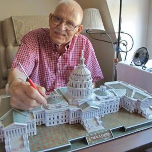 Alton Swett, a resident of Chase Point Assisted Living, with a model of the U.S. Capitol Building. Courtesy of Alan Crowell