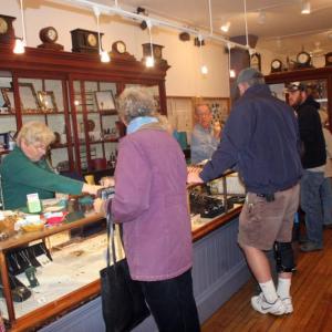 Debbie Andrews helps behind the counter with Tony Heyl at A Silver Lining during Men’s Night 2015. File photo