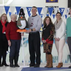 Chief Bob Hasch, this year’s Penguin Plunge honoree, is surrounded by other community advocates at the Boothbay Region YMCA pool on Thursday, Dec. 8. From left, Larry Brown, Holly Stover, Sue Burge, the Penguin, Bob Hasch, Karen-Ann Hagar, Anni Pat McKenney, and Andy Hamblett. SUE MELLO/Boothbay Register