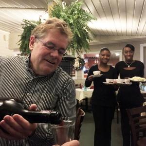 Ports of Italy manager Jeff Teel pours wine from a three-liter magnum on Friday, Dec. 2. SUZI THAYER/Boothbay Register