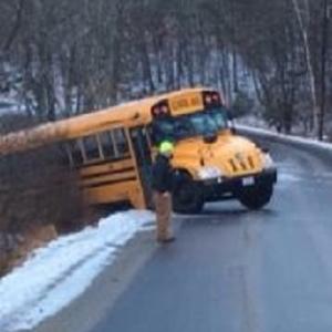 Icy conditions on Butler Road in Boothbay Thursday morning caused this bus to slide off the road, an AOS 98 official said. Courtesy of Maddy Faulkingham