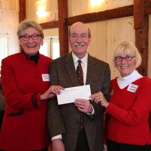 Miles League Vice President Marva Nesbit, left, and President Jane Lutsk presented LincolnHealth CEO Jim Donovan with the League’s first pledge payment at their holiday luncheon in December. Courtesy of LincolnHealth
