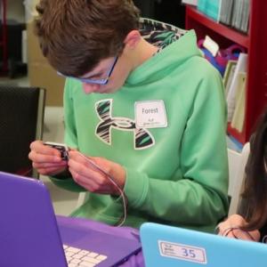 Forest Holbrook, a student at the Center for Teaching and Learning, attaches a text display device to his gizmo. Courtesy photo