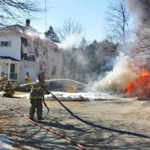 Boothbay Harbor firefighters work to contain the fire on Logan Road in Boothbay Harbor on Monday, March 13. Courtesy of Duey Graham