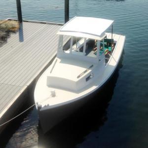 The Electra, a 23-foot electric lobster boat, in the water in Boothbay Harbor. Courtesy of Eric Graves/Boothbay Harbor Shipyard