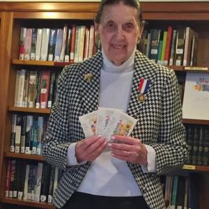 Clara Wentworth holds some of the seed packets she gave to her fellow Pemaquid Chapter members at the April 11 meeting. Courtesy of Audrey Miller