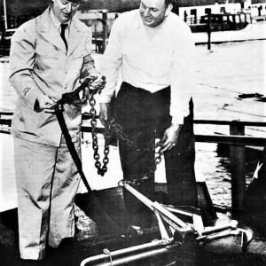 The uniforms have changed but the process of conducting a Vessel Safety Check remains the same. The USCG Auxiliary inspects all the items required by state and federal regulations for recreational boaters. The inspections are free and the results are confidential. Courtesy of the USCG Auxiliary archives.