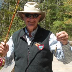 Catch of the Day. With no youth to teach, fly fisherman Steve Rubicam settles for catching minnows. ART MAYERS/Boothbay Register