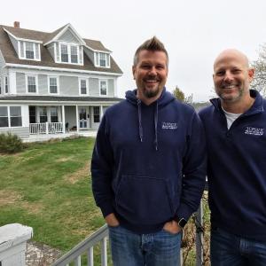 Buzz Makarewicz, left, and Mark Osborn in front of their Boothbay Harbor business, Topside Inn. SUZI THAYER/Boothbay Register