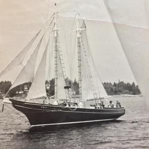 The Mary E, under full sail, heading out of Boothbay Harbor in 1972, with Captain Stan Parks at the helm. Courtesy of Stephen Rubicam