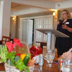 Holly Stover, addition outreach specialist, speaks as Auxiliary members look on. Courtesy photo