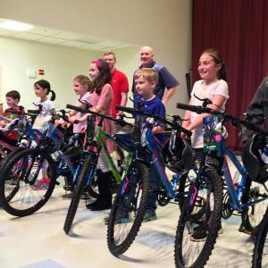 2017 Bikes for Books winners at Edgecomb Eddy School are, from left: Charlotte Abello, Ethan Clark, Morganne Phelps, Abbie Clark, Aliyah Bowley, Takoda Dionne, Hannah Abello and Anna Gosselin. Not pictured are fellow winners Silas Lehouillier, Emily Gosselin and Lydia Currier. SUZI THAYER/Boothbay Register